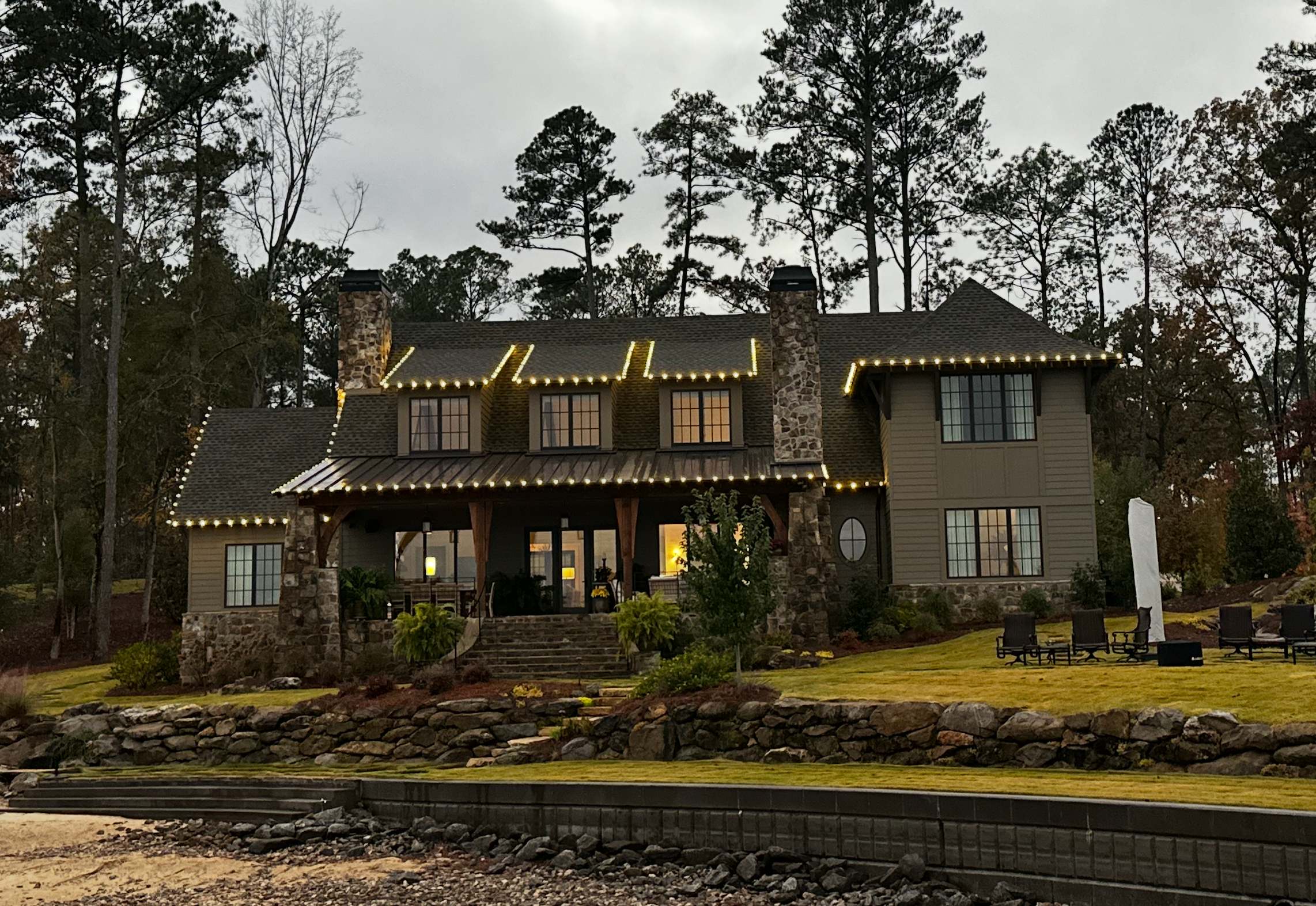 Lakehouse with professional holiday lighting installation